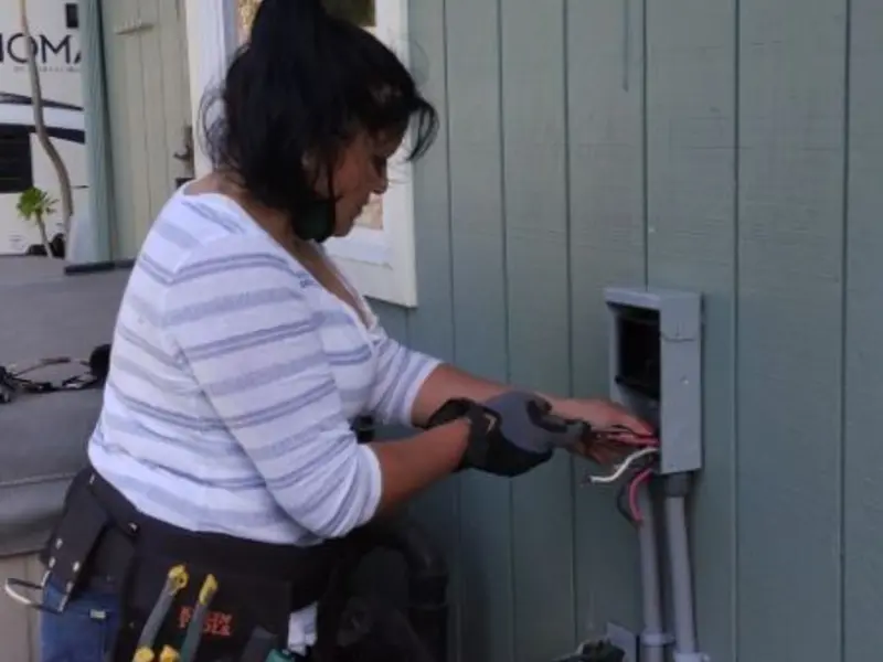 Licensed electrician wiring an exterior subpanel in Santa Teresa
